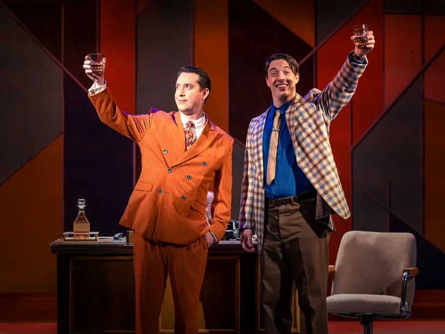 Production photo from Promises, Promises showing Gretchen Ugalde's scenic design in performance at Okoboji Summer Theatre.